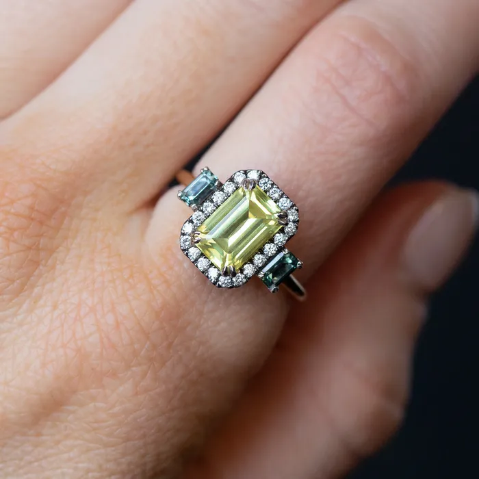 262ct Emerald Cut Nigerian Sapphire and Montana Sapphire Low Profile Scallop Cut Three Stone Ring with Antiqued Diamond Halo in 18k Yellow Gold Anueva Jewelry Rings