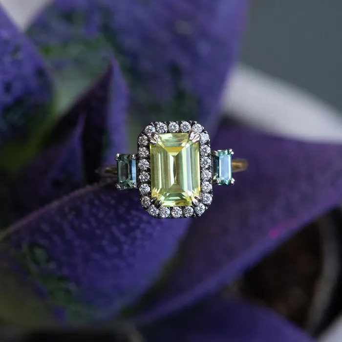 262ct Emerald Cut Nigerian Sapphire and Montana Sapphire Low Profile Scallop Cut Three Stone Ring with Antiqued Diamond Halo in 18k Yellow Gold Anueva Jewelry Rings